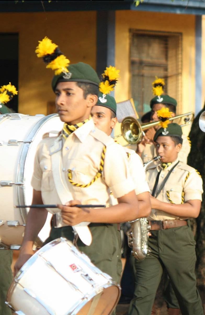 Royal College Cadet playing the drum
